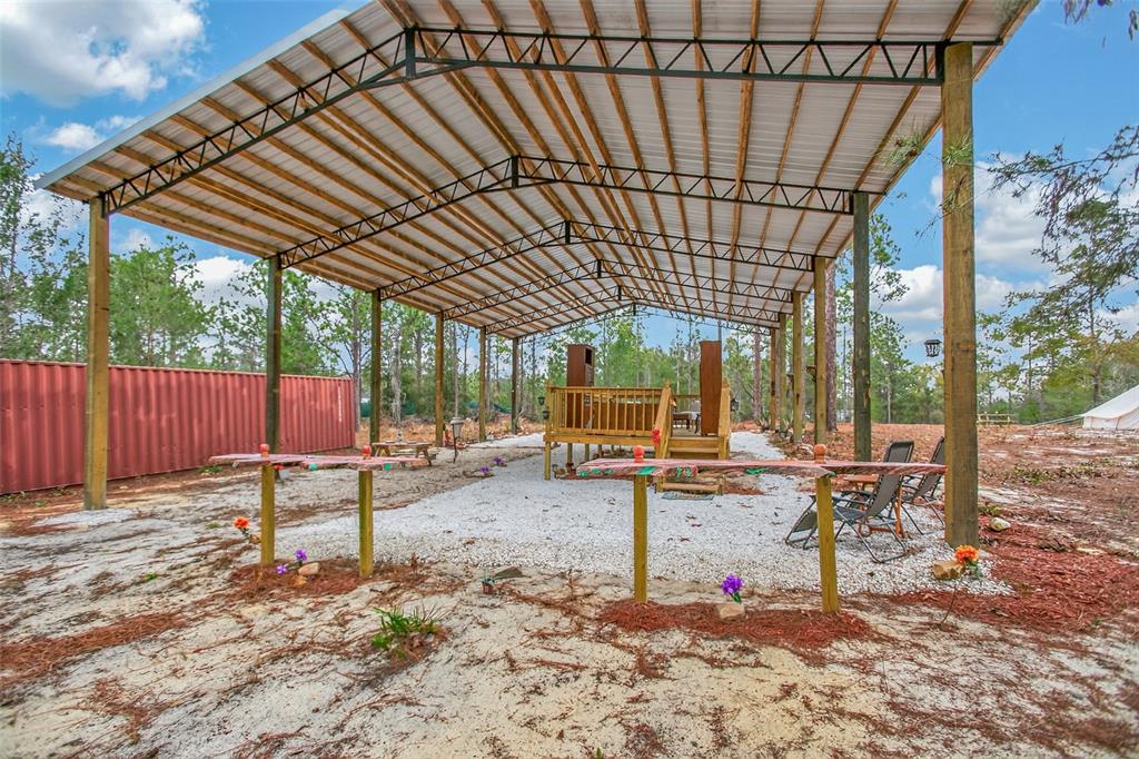 419 Lily Trail Interlachen, FL 32148 - Photo 50 of 82 a view of a backyard with sitting area