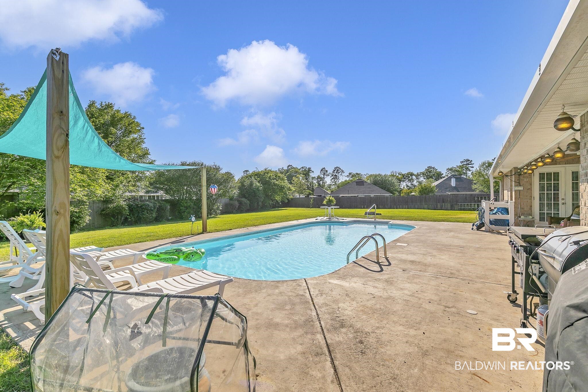 16358 Tempest Drive Foley, AL 36535 - Photo 37 of 46 View of pool with a fenced in pool, french doors, a fenced backyard, a lawn, and a patio