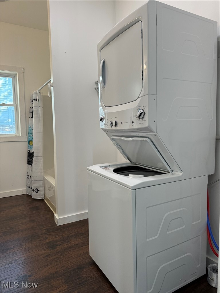 9529 Ashland Road Wooster, OH 44691 - Photo 14 of 24 Laundry area featuring stacked washer and dryer and dark hardwood / wood-style flooring
