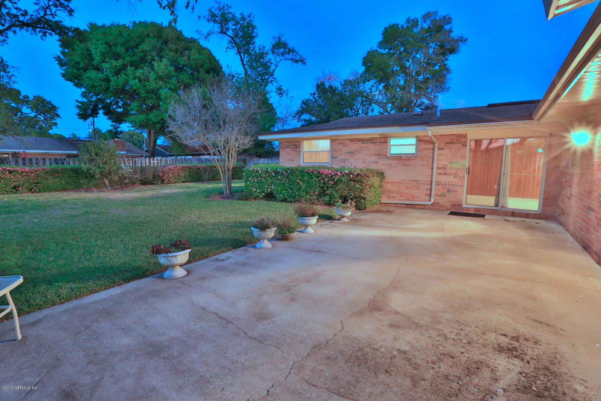 7305 Floral Ridge Drive Jacksonville, FL 32277 - Photo 12 of 27 a view of a house with backyard and garden