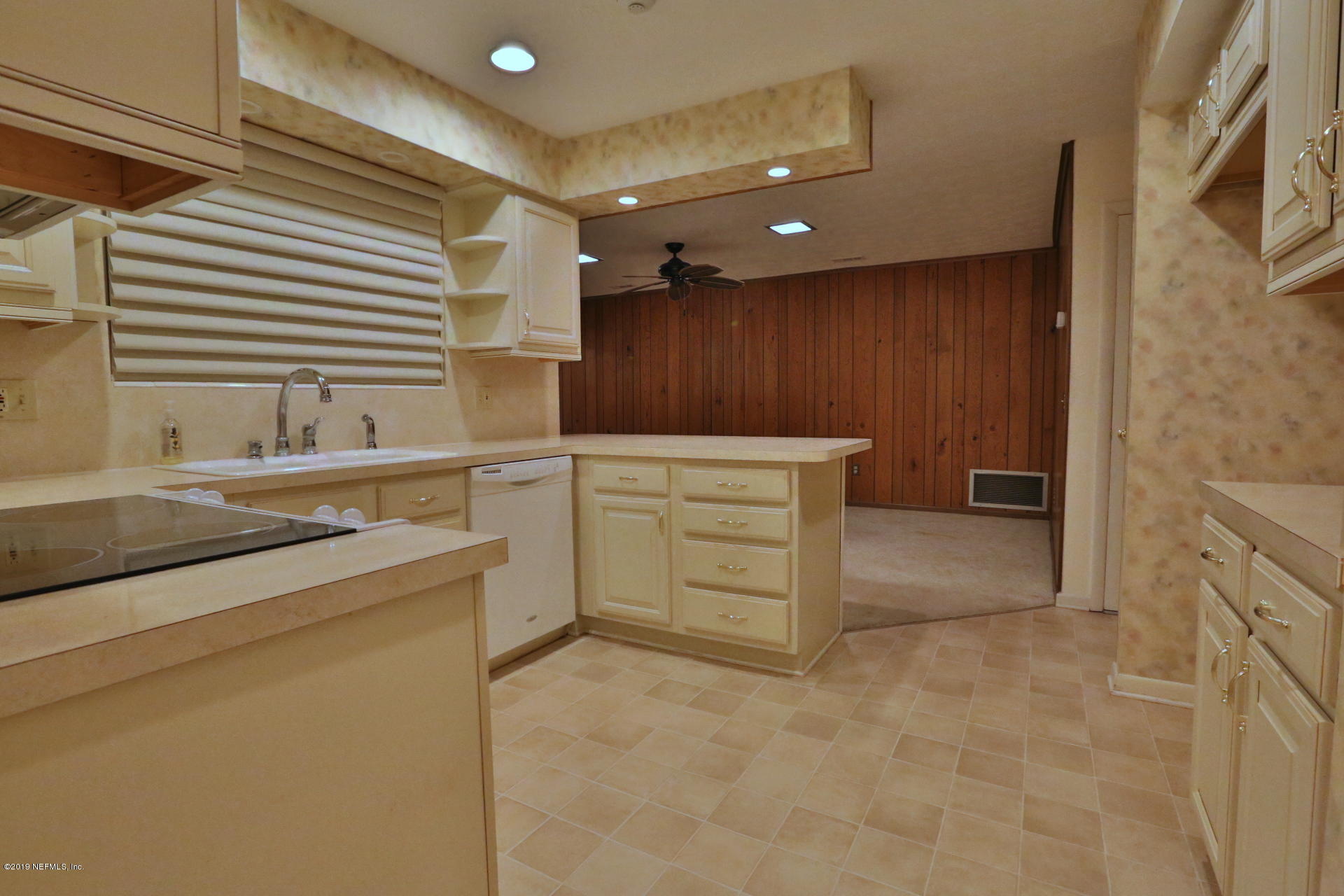 7305 Floral Ridge Drive Jacksonville, FL 32277 - Photo 19 of 27 a kitchen with a sink and cabinets