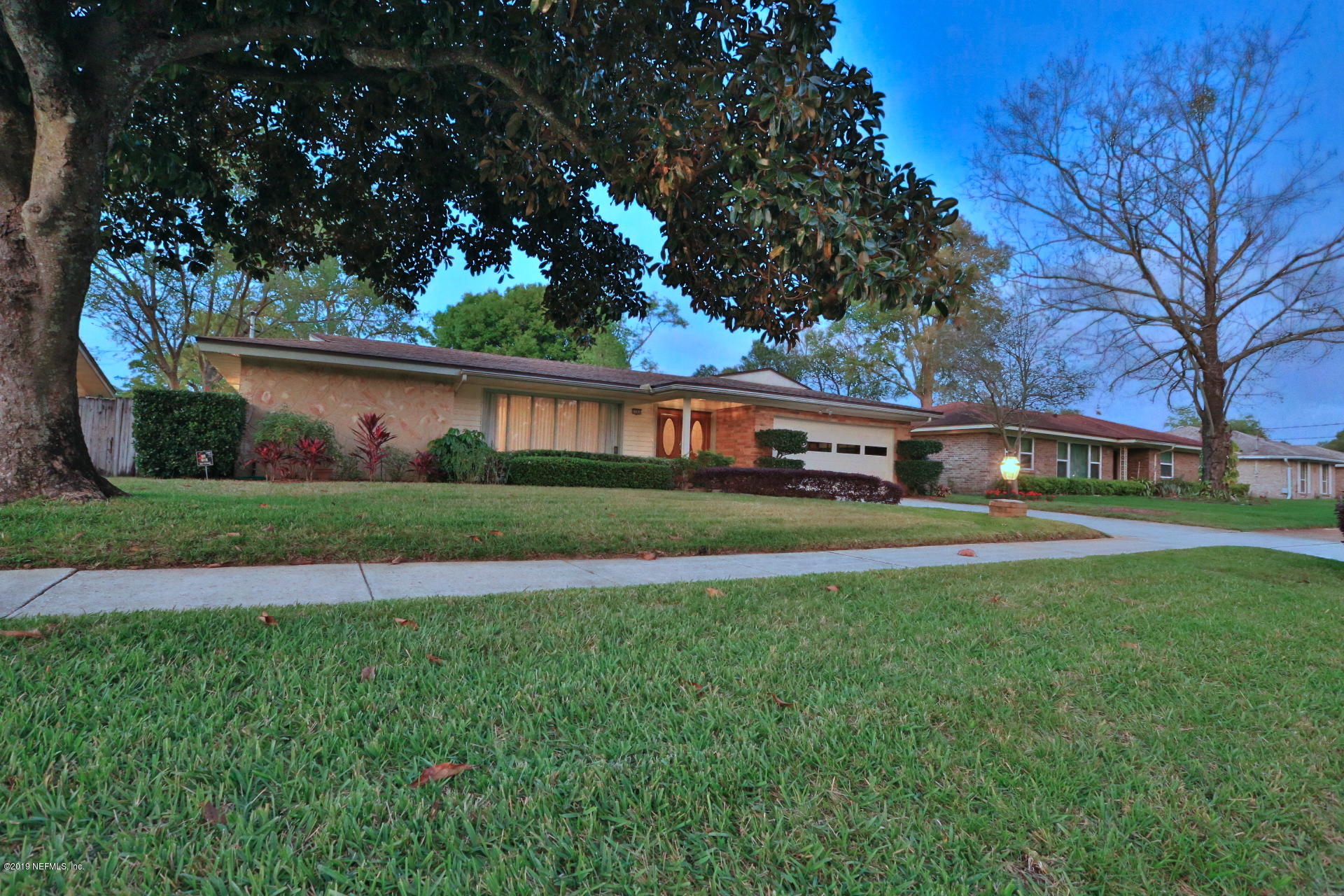 7305 Floral Ridge Drive Jacksonville, FL 32277 - Photo 2 of 27 a front view of house with yard