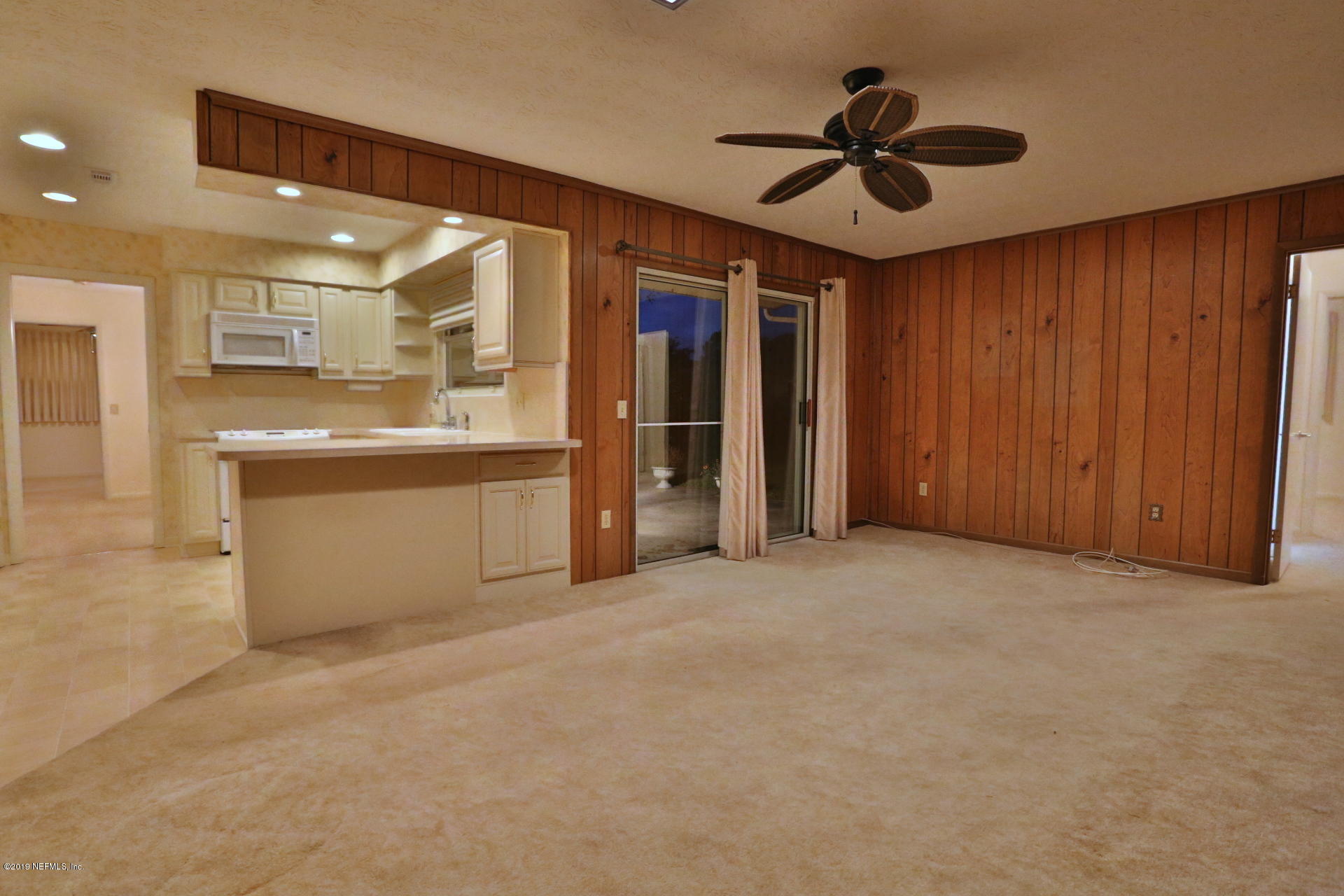 7305 Floral Ridge Drive Jacksonville, FL 32277 - Photo 21 of 27 a view of an empty room with a kitchen