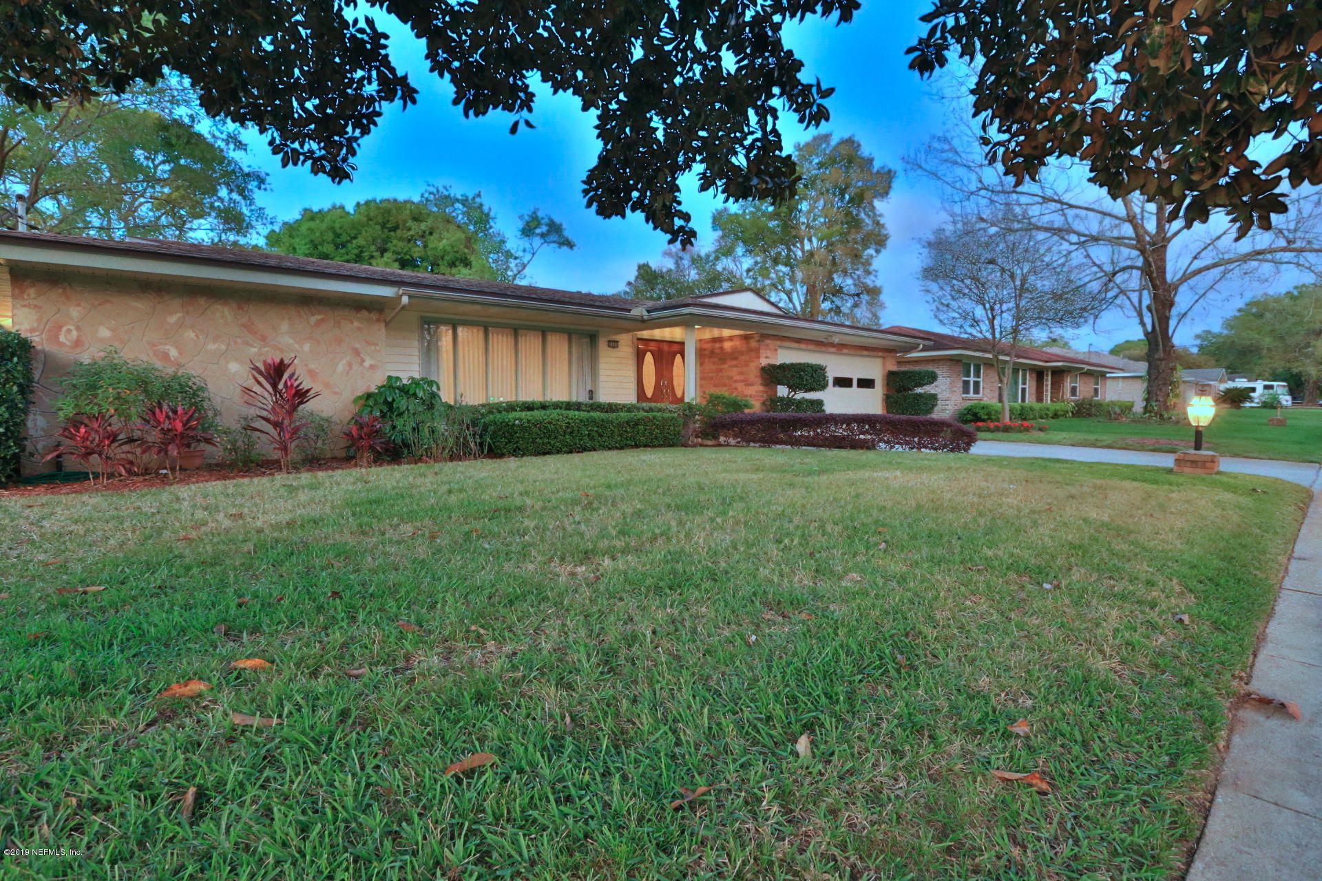 7305 Floral Ridge Drive Jacksonville, FL 32277 - Photo 3 of 27 front view of house with a yard