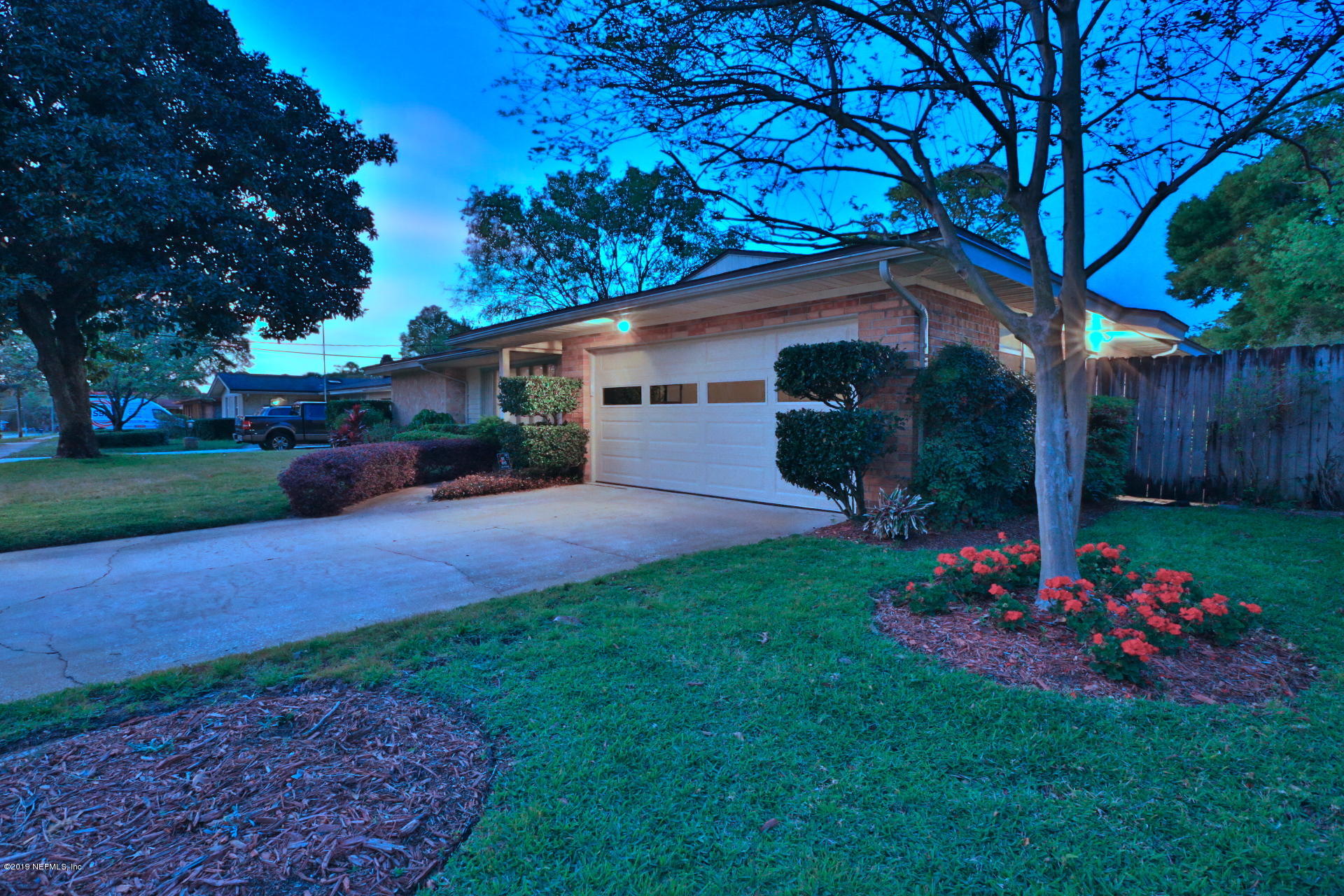 7305 Floral Ridge Drive Jacksonville, FL 32277 - Photo 6 of 27 a front view of a house with garden