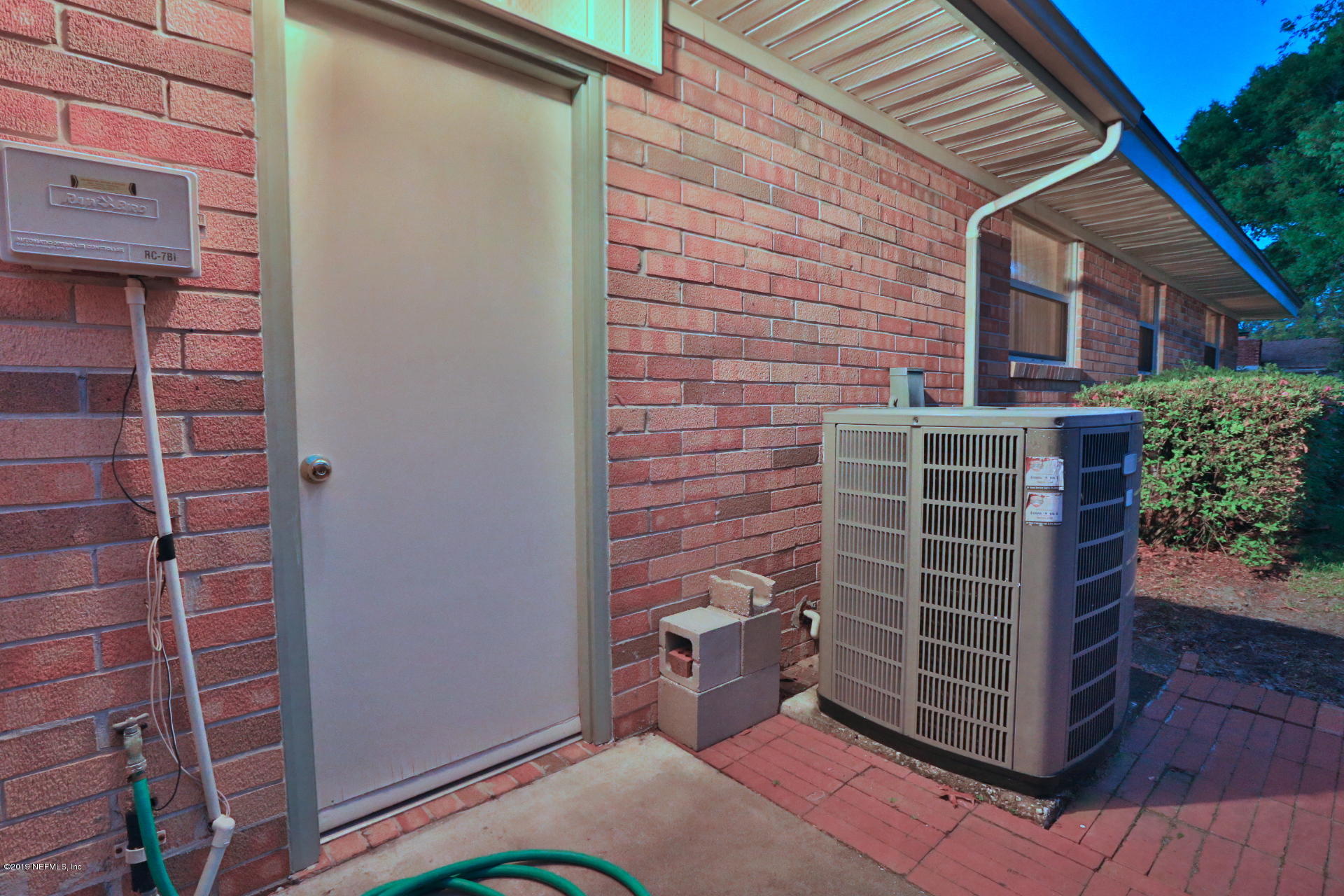 7305 Floral Ridge Drive Jacksonville, FL 32277 - Photo 7 of 27 a view of outdoor space and wooden door