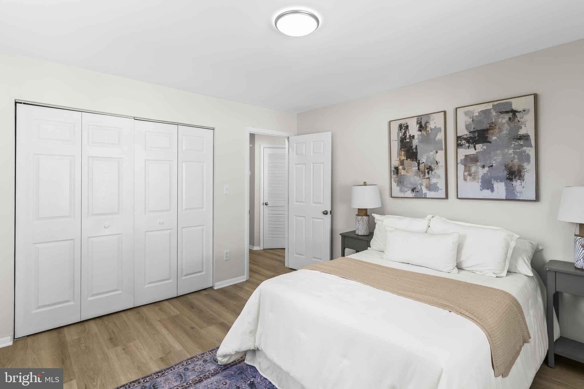 1923 Ridgeville Road Edgewater, MD 21037 - Photo 11 of 15 a bedroom with a bed and a painting on the wall