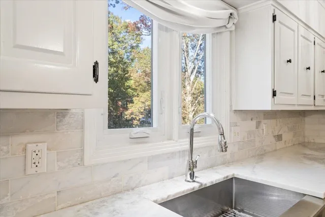 a bathroom with a bathtub and shower