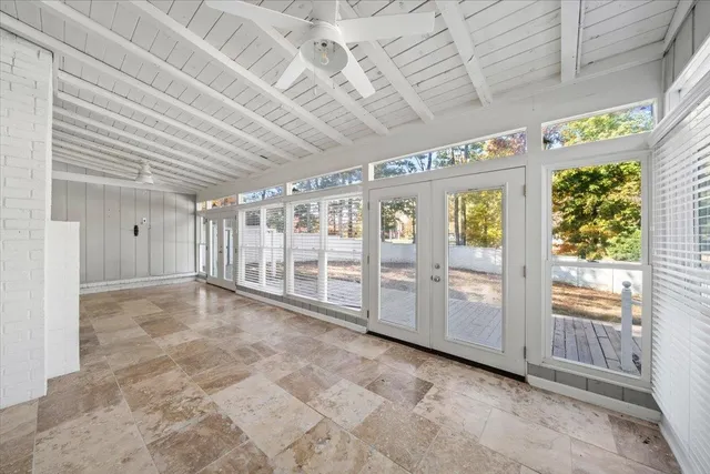 a view of an empty room with windows