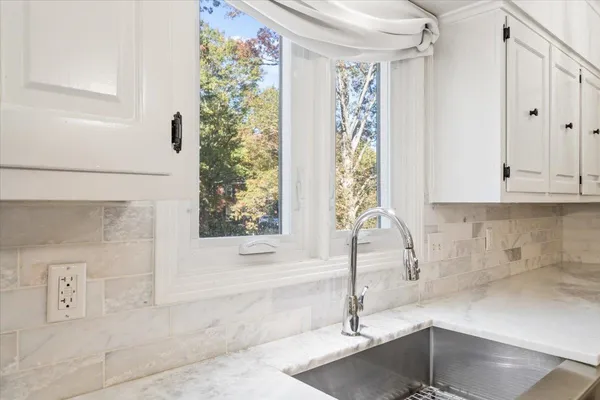 a bathroom with a bathtub and shower