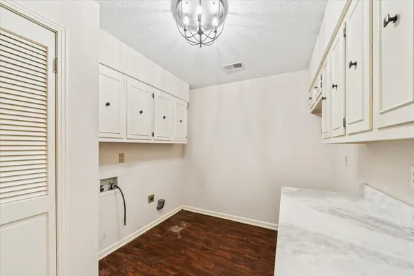 a view of kitchen with wooden floor