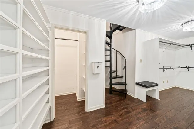 a view of entryway with wooden floor and stairs