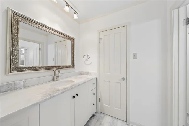 an empty room with fan and windows