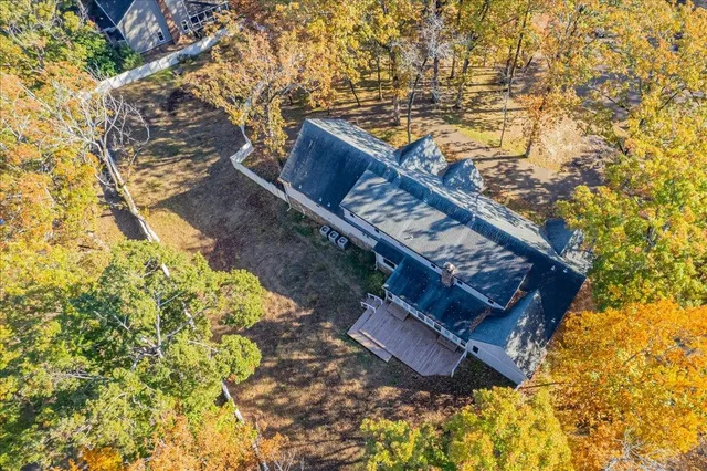 a view of a backyard with wooden fence