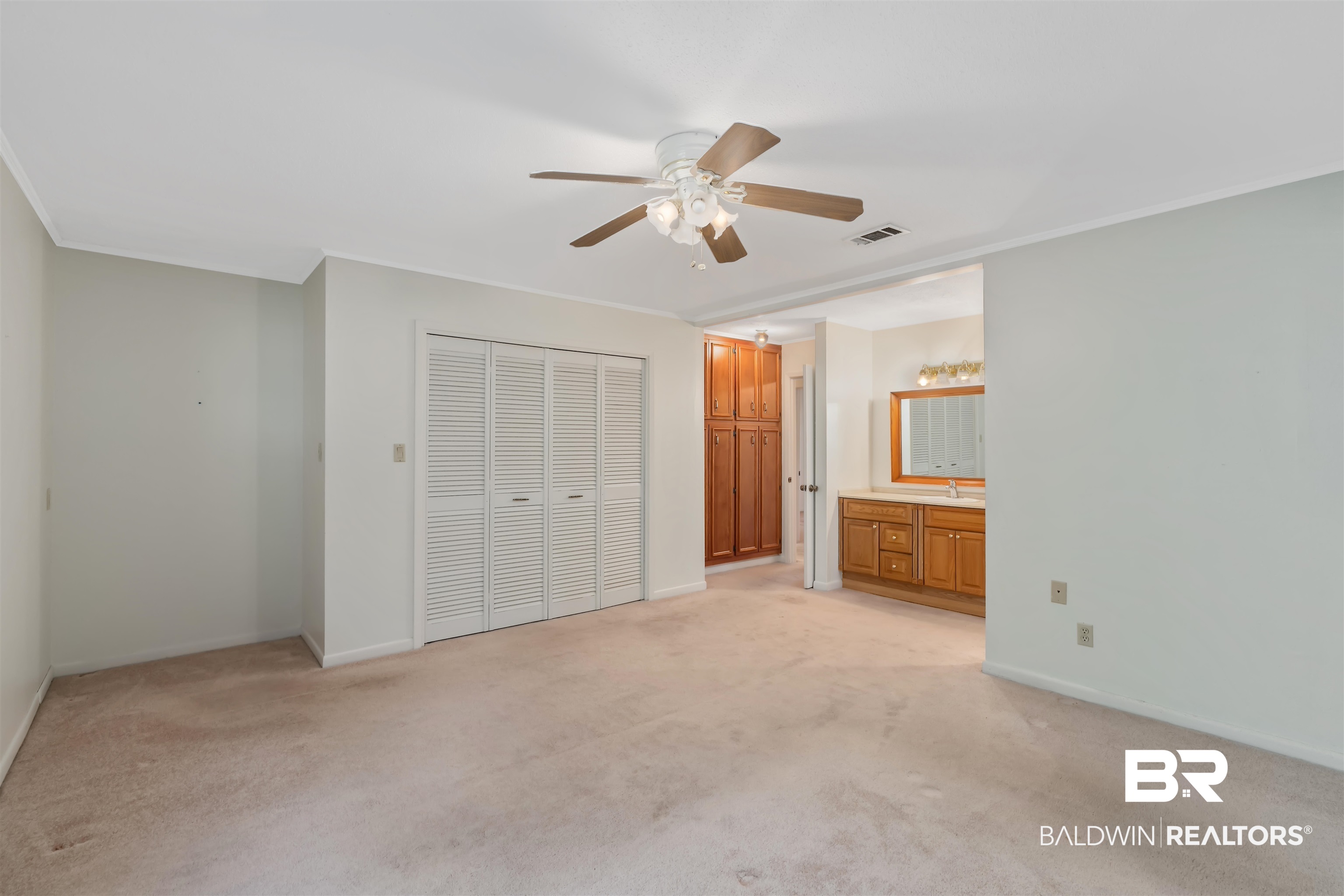 621 Spanish Main Spanish Fort, AL 36527 - Photo 22 of 29 Unfurnished bedroom with ceiling fan, ornamental molding, light carpet, and ensuite bath