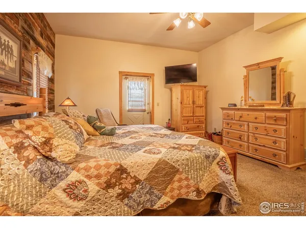 a bedroom with a bed and cabinets