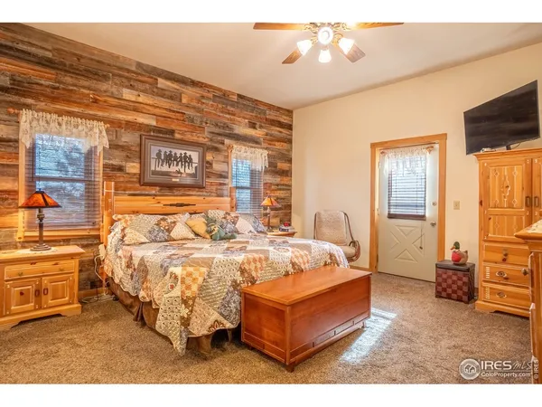 a bed room with a bed and a tv