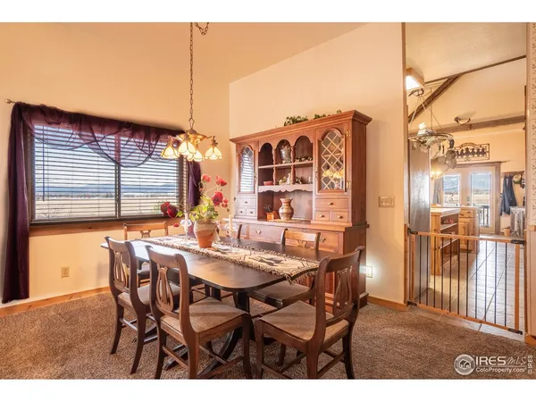 a dining room with furniture and window