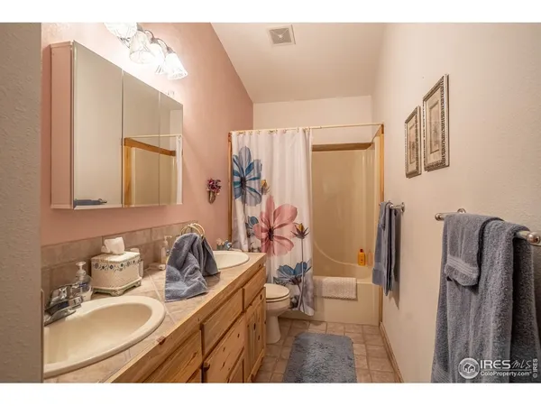 a bathroom with a sink double vanity and a mirror