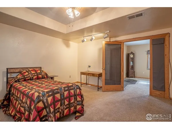 a bedroom with a bed and a cabinets