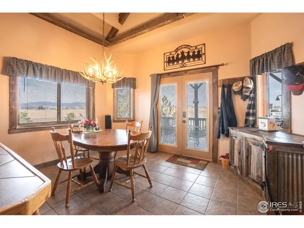 a view of a patio with a table and chairs