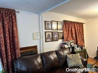 164-54 Nadal Place Queens, NY 11433 - Photo 2 of 9 a living room with furniture and a window