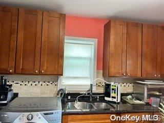 164-54 Nadal Place Queens, NY 11433 - Photo 6 of 9 a view of a kitchen with a sink and cabinets