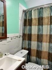 164-54 Nadal Place Queens, NY 11433 - Photo 9 of 9 a bathroom with a sink and a shower