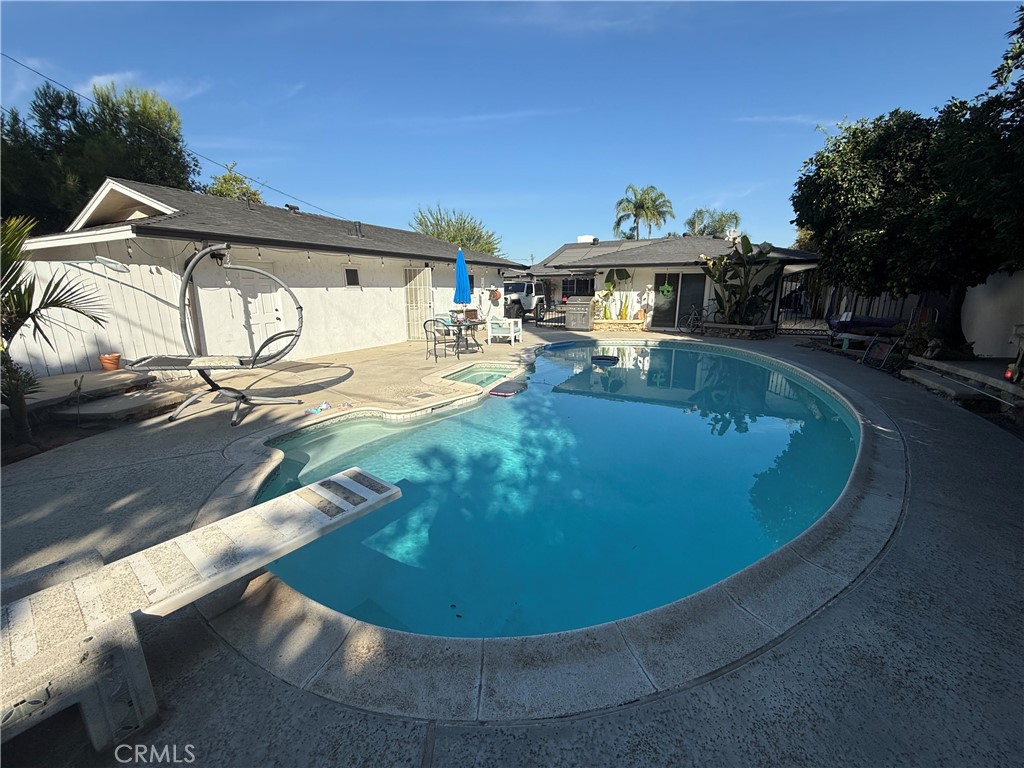 5836 Old Ranch Road Riverside, CA 92504 - Photo 12 of 59 a view of a swimming pool with an outdoor seating