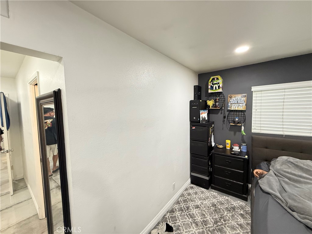 5836 Old Ranch Road Riverside, CA 92504 - Photo 13 of 59 a bedroom with a bed and a closet