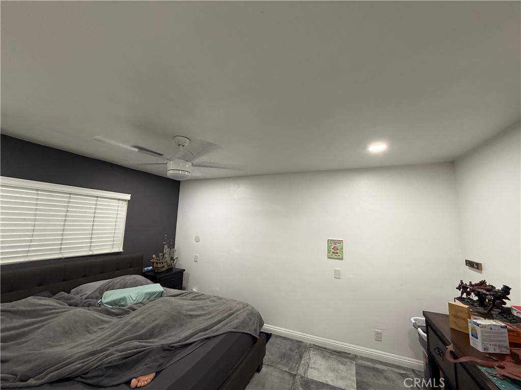 5836 Old Ranch Road Riverside, CA 92504 - Photo 14 of 59 a bedroom with a bed and a window