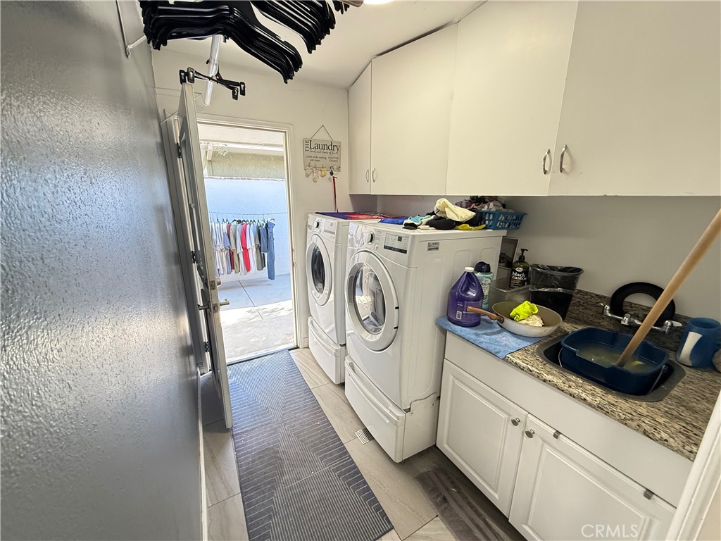 5836 Old Ranch Road Riverside, CA 92504 - Photo 18 of 59 a utility room with dryer and washer