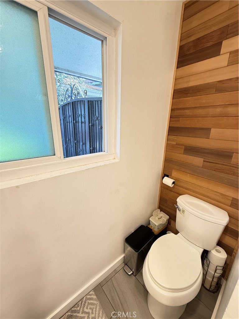 5836 Old Ranch Road Riverside, CA 92504 - Photo 21 of 59 a white toilet sitting next to a small window