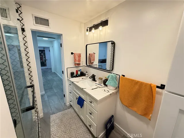 a bathroom with a bathtub and shower