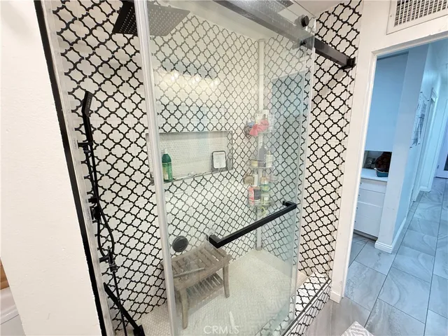 a bedroom with bed and a couch