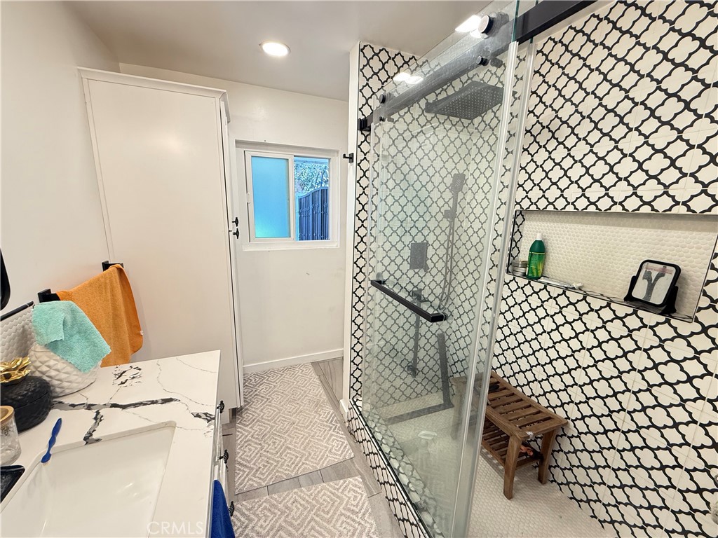 5836 Old Ranch Road Riverside, CA 92504 - Photo 24 of 59 a bathroom with a bathtub and shower