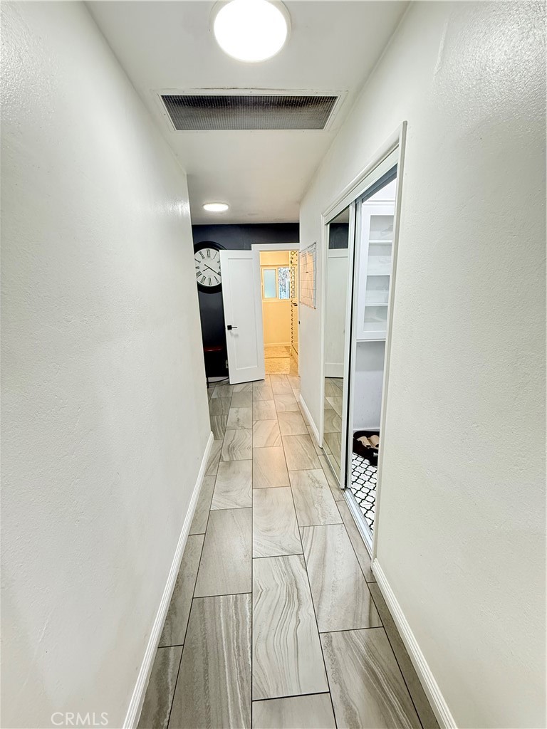 5836 Old Ranch Road Riverside, CA 92504 - Photo 27 of 59 a view of hallway with a large window