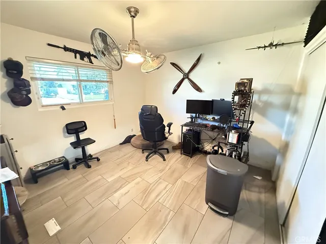 a bed room with a bed and a television