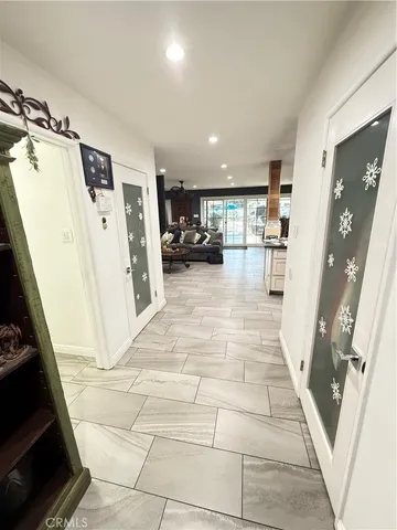 a bedroom with a bed and a flat tv screen in it