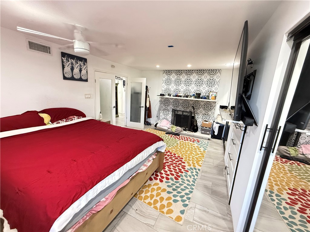 5836 Old Ranch Road Riverside, CA 92504 - Photo 33 of 59 a bed room with a bed and a television