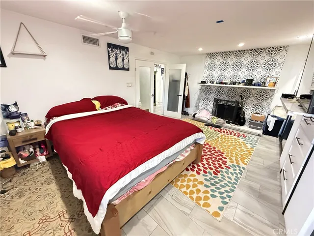 a view of a utility room with closet and mirror