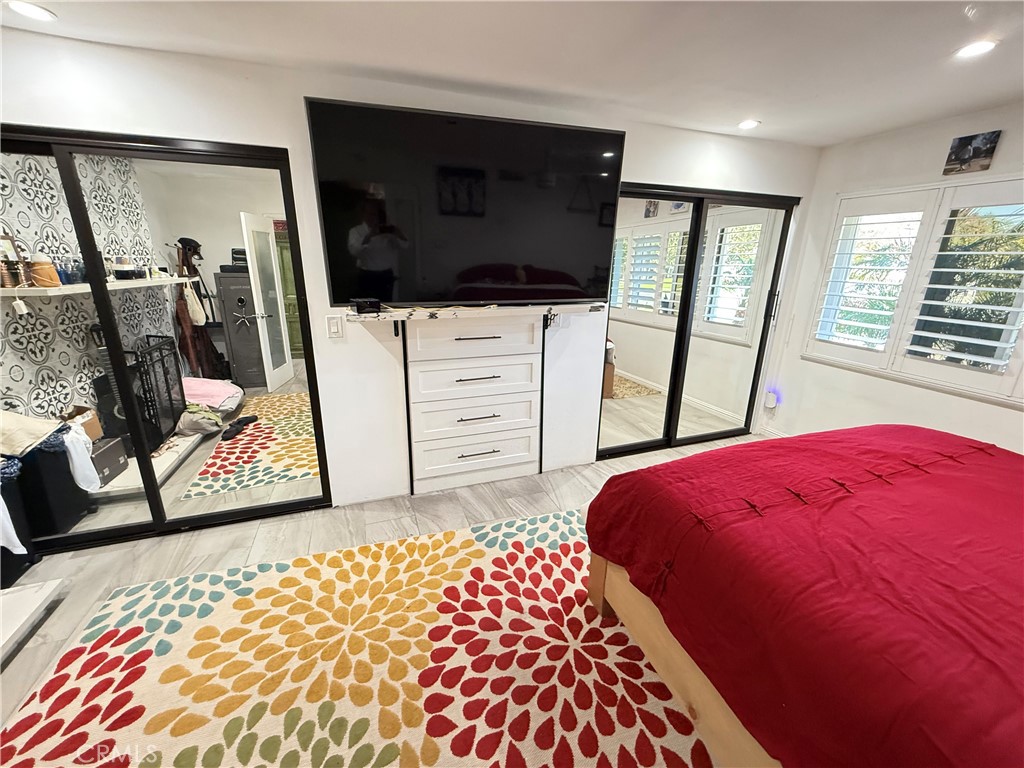 5836 Old Ranch Road Riverside, CA 92504 - Photo 37 of 59 a bedroom with a bed and a flat tv screen in it