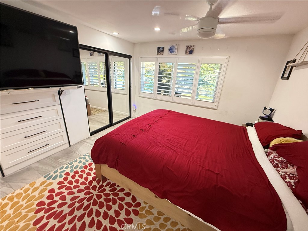 5836 Old Ranch Road Riverside, CA 92504 - Photo 38 of 59 a bedroom with a bed and a flat screen tv