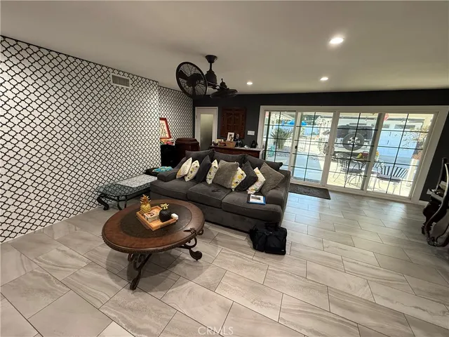 a view of bathroom with washing machine and mirror