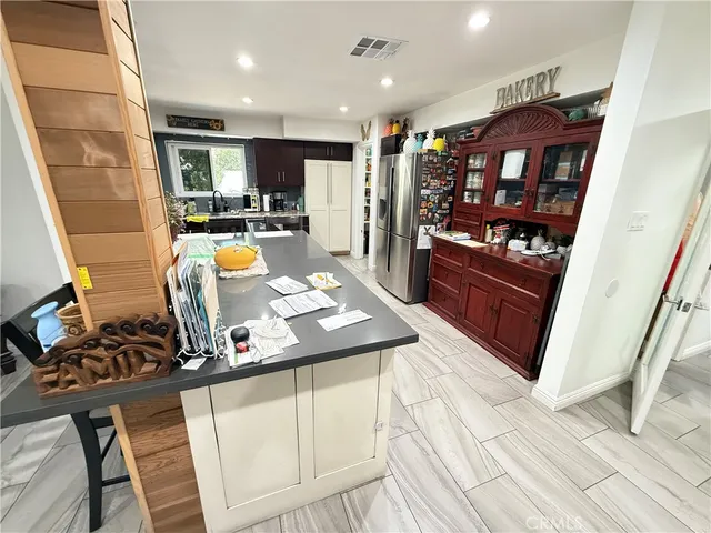 a utility room with closet and mirror