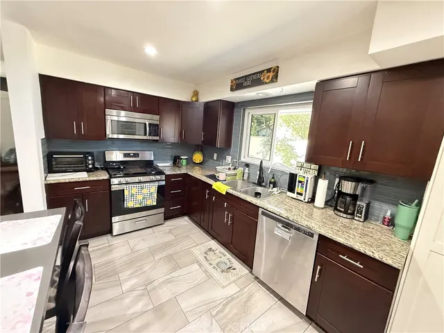 an empty room with windows and entrance