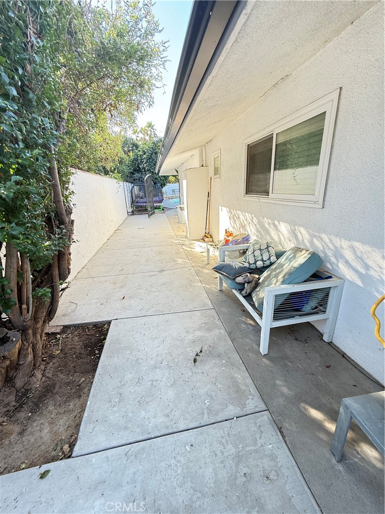 5836 Old Ranch Road Riverside, CA 92504 - Photo 50 of 59 a living room with furniture and a table
