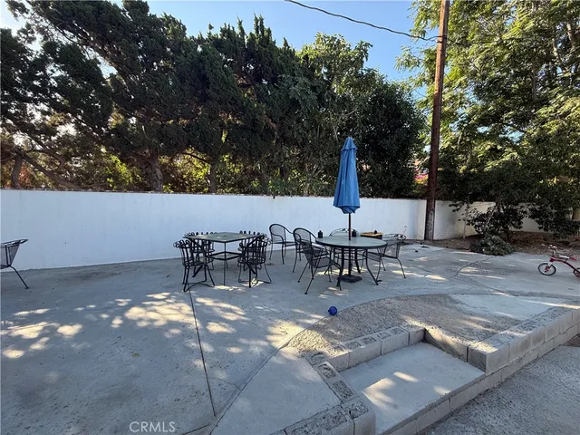 a view of outdoor space with lounge chairs