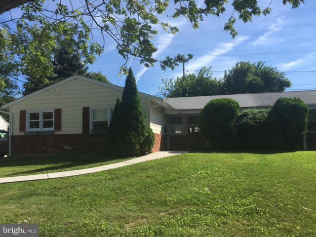 2013 Kennicott Road Baltimore, MD 21244 - Photo 1 of 12 a front view of a house with a yard