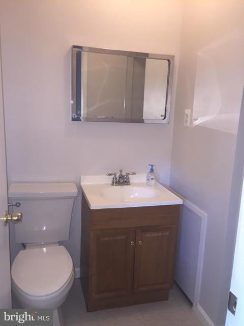 2013 Kennicott Road Baltimore, MD 21244 - Photo 4 of 12 a bathroom with a toilet sink and mirror
